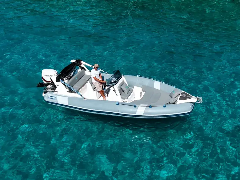 Marlin 23s RIB anchored in turquoise Ionian water